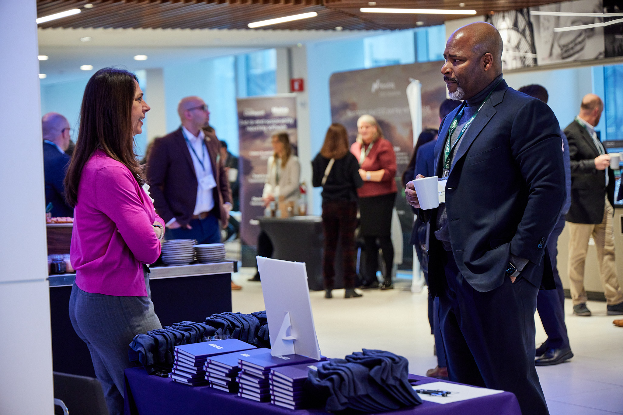 A conversation happening in the exhibition hall at the corporate secretary forum