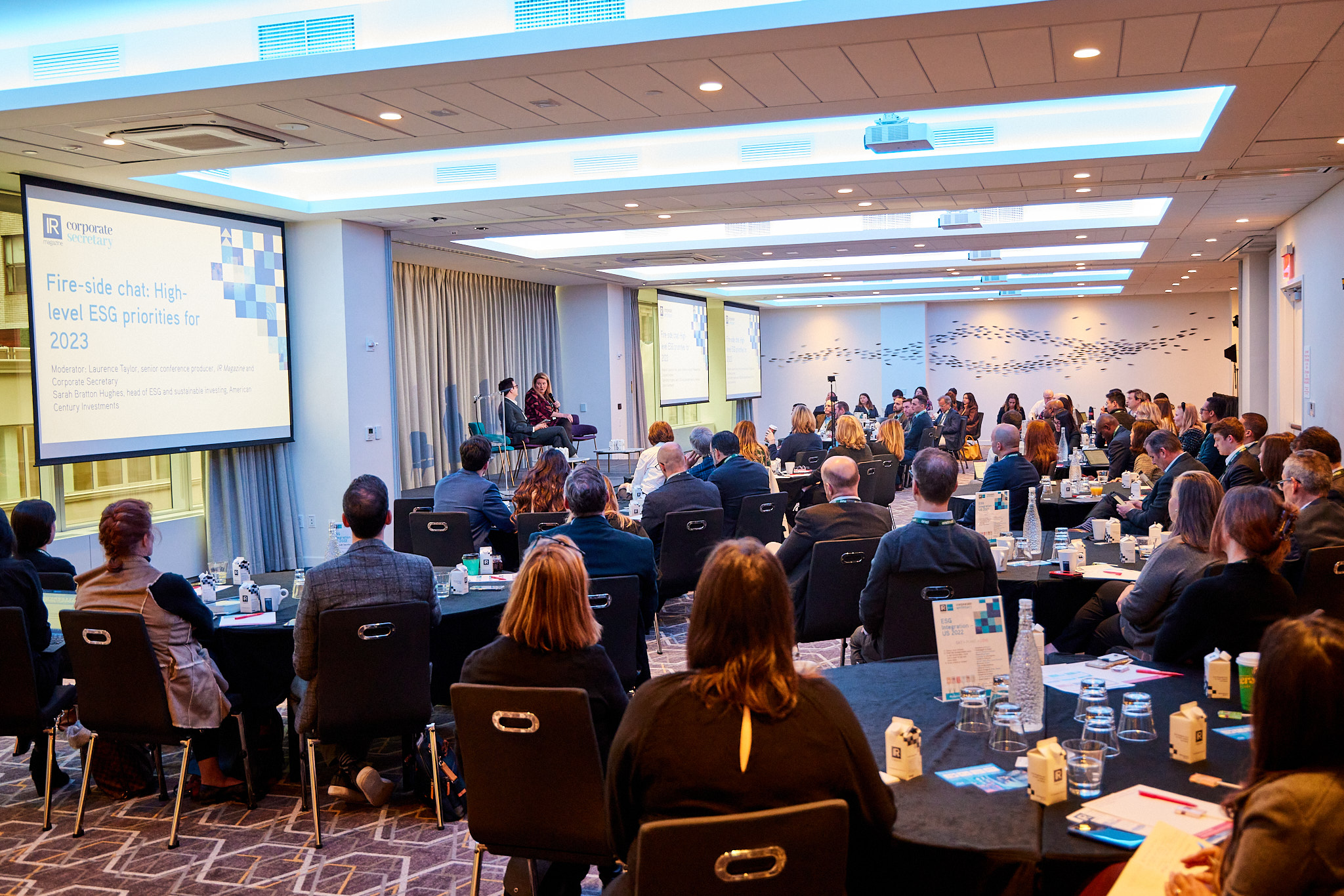A full room of attendees at the corporate secretary forum